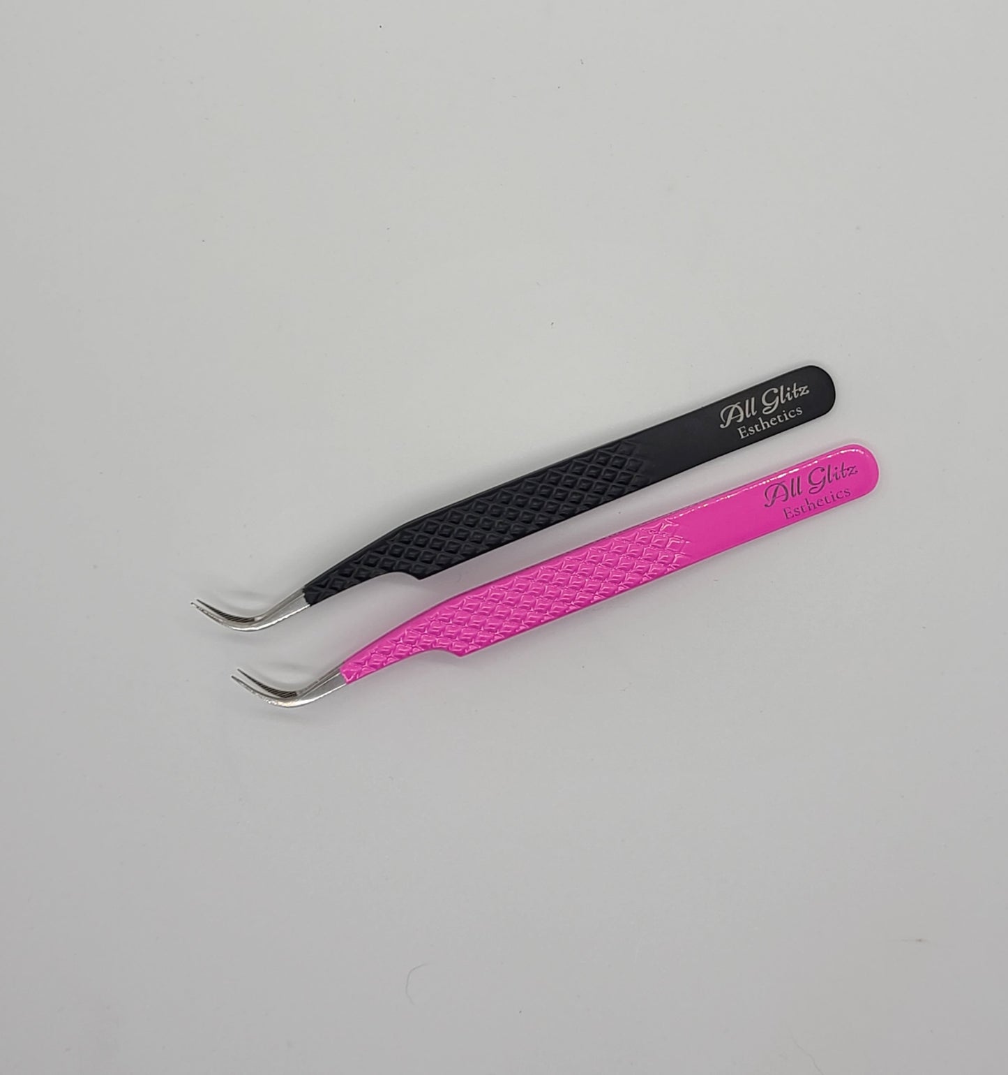 Fiber tip curved volume tweezers